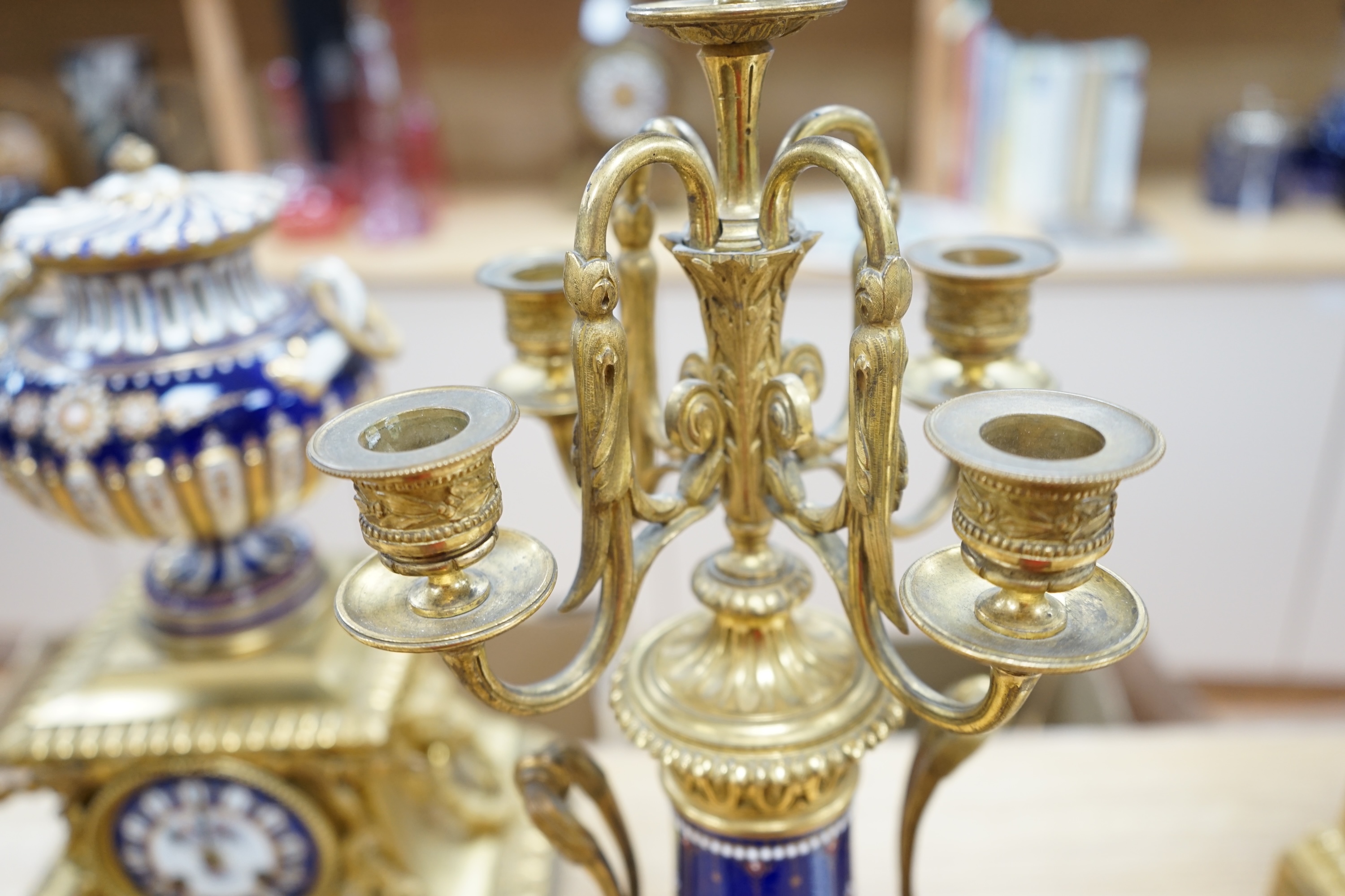 A 19th century Sevres style jewelled porcelain and ormolu matched clock garniture, striking on a bell, with pendulum, 51cm high. Condition - fair to good, minor restoration, untested